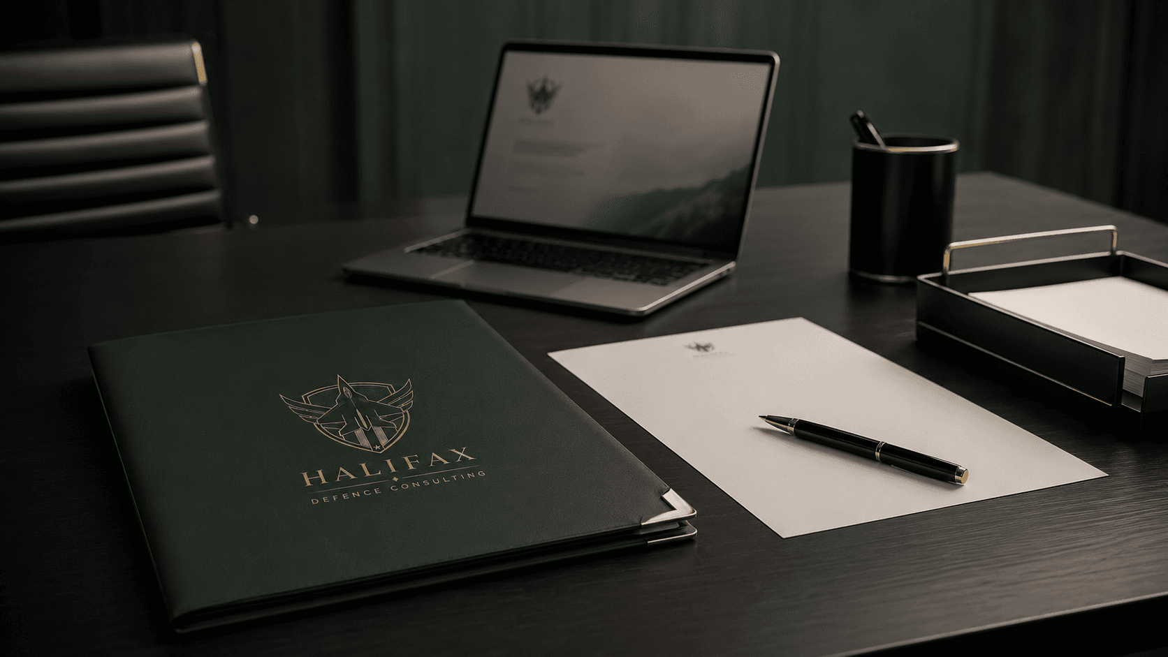 Branded policy notebook and pen on secure desk